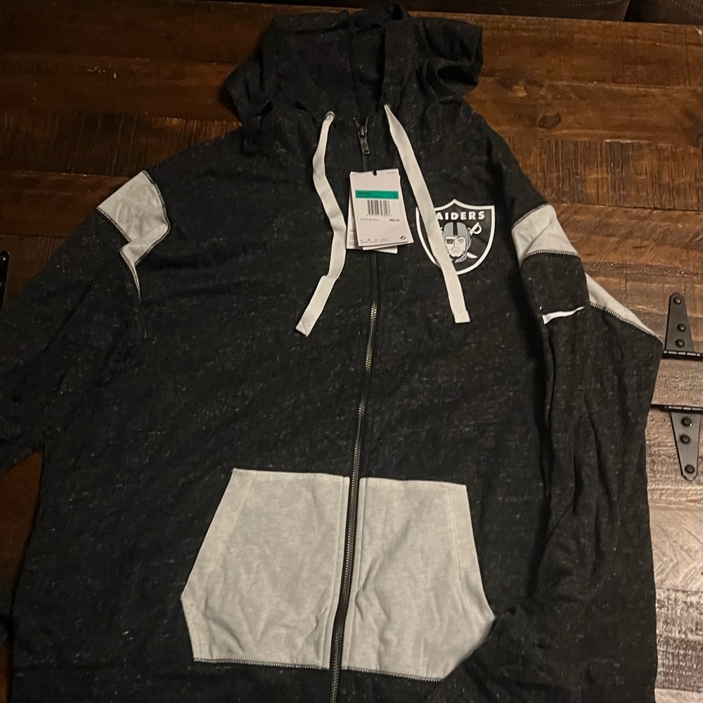 Brand new womens raiders zip up Nike brand